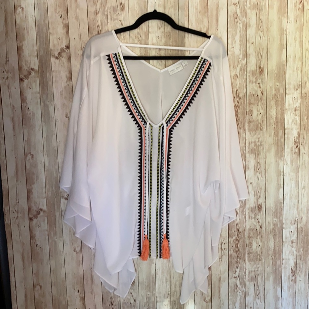 White sheer blouse with tassels